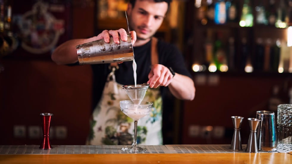 Connect with loved ones during the lockdown barman pouring cocktail